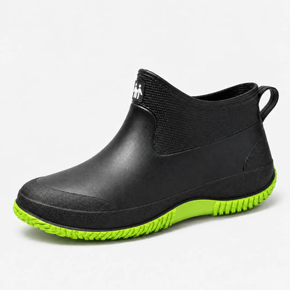 Kurze Gummistiefel Damen in Schwarz mit grüner Sohle – Produktfoto