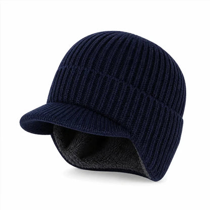 Mütze mit Ohrenklappen in Marineblau – Strickmütze mit Schirm, dunkles Fleecefutter sichtbar