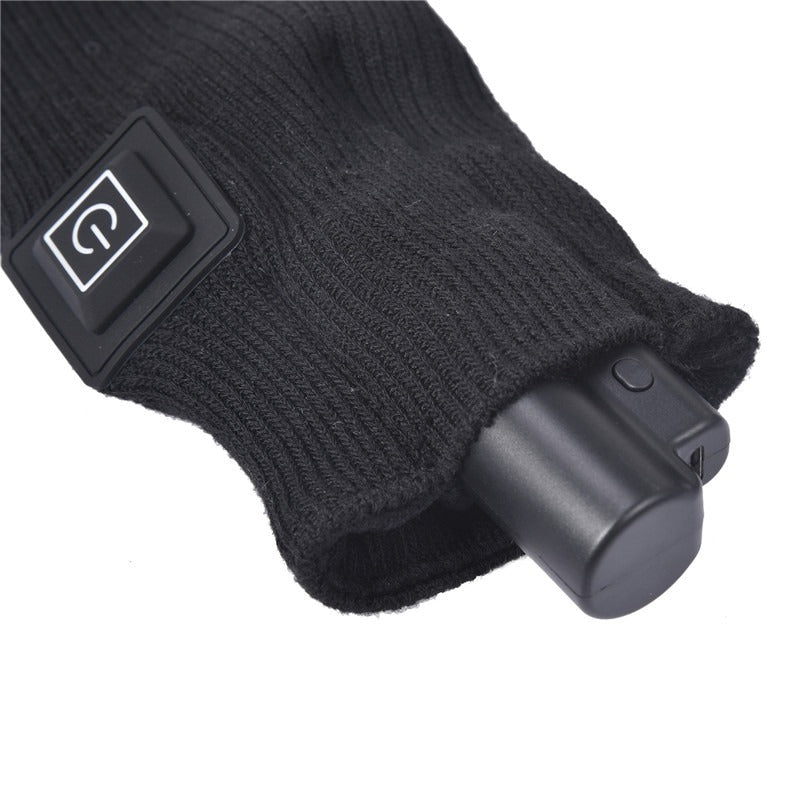 Beheizbare Socken mit Akku – Akkupack steckt in der Tasche am Bündchen neben der Taste