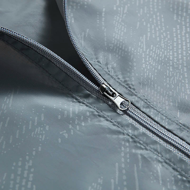 Übergangsjacke Herren - Wasserabweisender Windbreaker - Faltbar mit Packbeutel