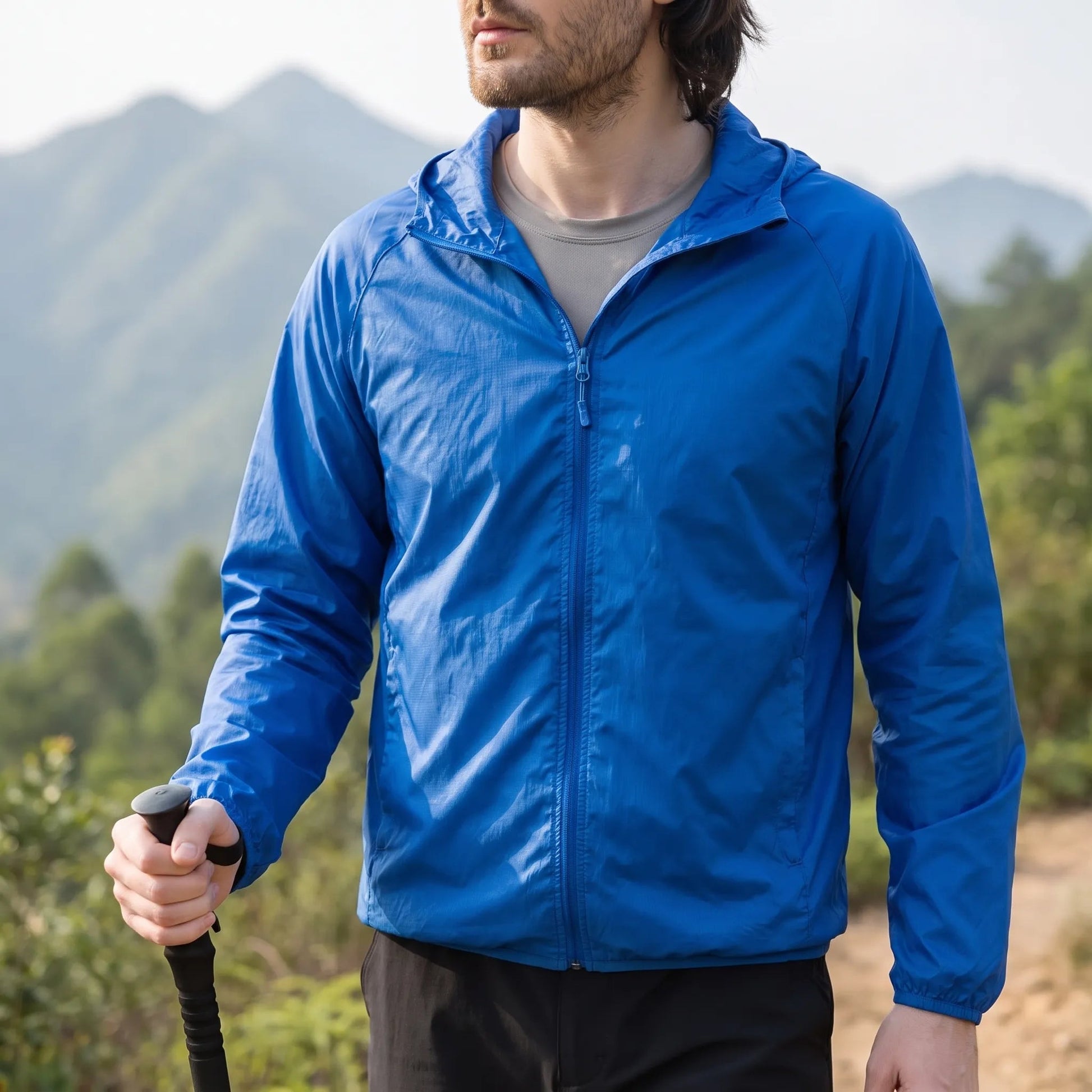 Leichte packbare Windjacke mit Kapuze, unisex, wind- und wasserabweisend
