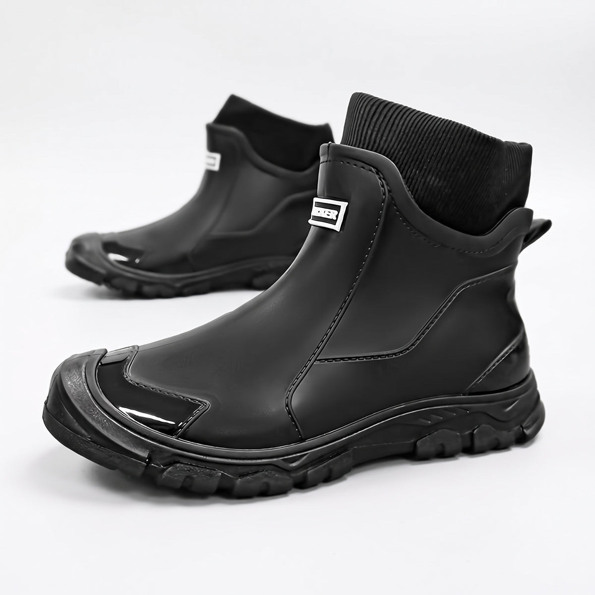 Gummistiefel gefüttert Damen & Herren, Farbe Schwarz – Paar auf weißem Hintergrund
