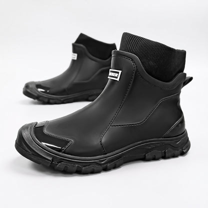 Gummistiefel gefüttert Damen & Herren, Farbe Schwarz – Paar auf weißem Hintergrund